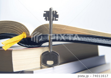 Key and open textbook of life. The book is the key and opening to knowledge and wisdom. Key and open textbook of life. The book is the key and opening to knowledge and wisdom. 74011617