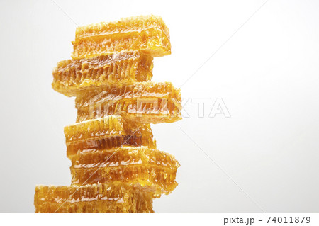 portions of fresh honeycomb on a white background. vitamin natural food. bee work product portions of fresh honeycomb on a white background. vitamin natural food. bee work product 74011879