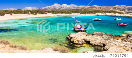 Beautiful wild  beaches of Naxos island. Scenery with fishing boats 74012794