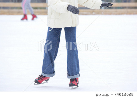 ice skating woman legs on ice rink. hobbies and winter sports 74013039