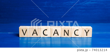 Wooden blocks with the word Vacancy. Hire a worker. Position offered by a business. Workplace. Human Resource Management. Recruiting Headhunting. Hiring employees Wooden blocks with the word Vacancy. Hire a worker. Position offered by a business. Workplace. Human Resource Management. Recruiting Headhunting. Hiring employees 74013214