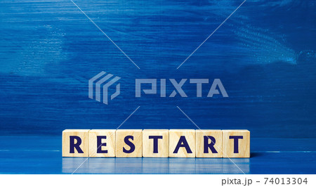 Wooden blocks with the word Restart. New beginning and launch. Start of a new process. Back to the roots. Business concept. Start again. Renewal Wooden blocks with the word Restart. New beginning and launch. Start of a new process. Back to the roots. Business concept. Start again. Renewal 74013304