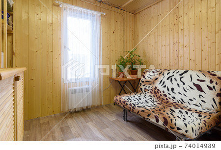 Interior of a small modest living room of a country house Interior of a small modest living room of a country house 74014989