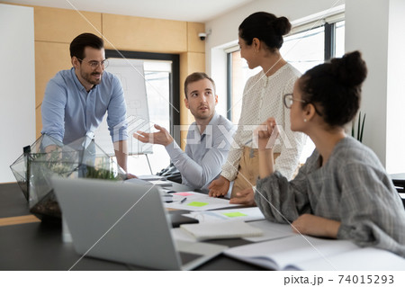 Diverse business team discussing project at corporate briefing 74015293