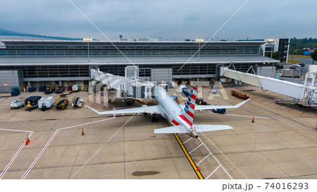 Aerial view of regional airport with terminal and airplanes 74016293