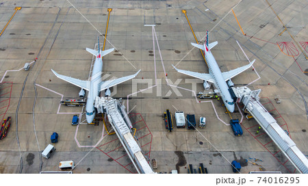 Aerial view of regional airport with terminal and airplanes 74016295