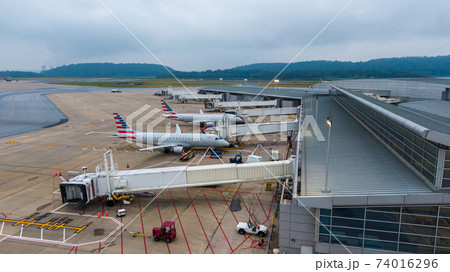 Aerial view of regional airport with terminal and airplanes 74016296