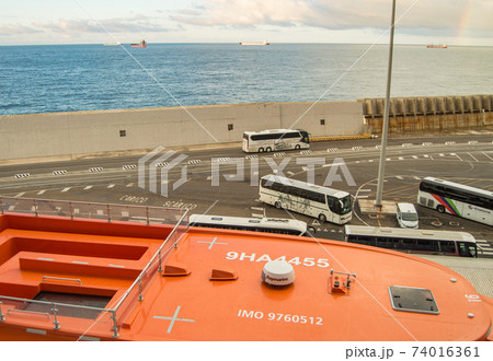 Italy, Civitavecchia, October 07, 2018: View of the pier and Parking of tourist buses, from the deck of the cruise liner MSC Meraviglia Italy, Civitavecchia, October 07, 2018: View of the pier and Parking of tourist buses, from the deck of the cruise liner MSC Meraviglia 74016361