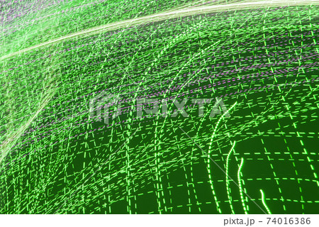 Abstract background of blurred colorful movements of led lamps, green lines on a dark background 74016386