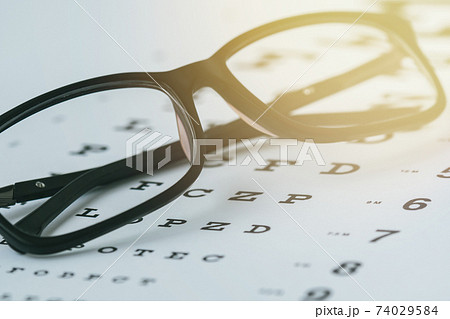 Glasses on the eye sight test chart Glasses on the eye sight test chart 74029584