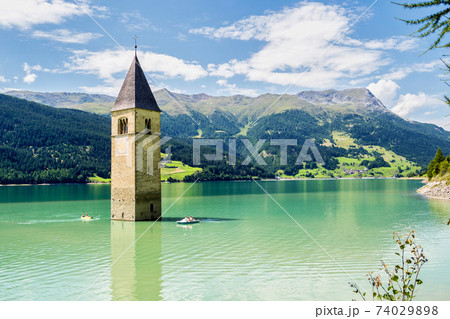 Church in the water at Lake Reschen in Tyrol in north Italy Church in the water at Lake Reschen in Tyrol in north Italy 74029898