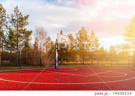 Basketball court found in the outdoors during autumn season 74030314