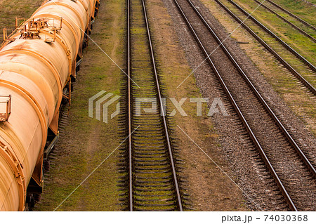 Train delivering gasoline in tanks. View from above. Train delivering gasoline in tanks. View from above. 74030368