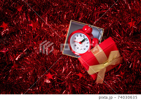 Christmas and New Year holiday composition with gift box and alarm clock 74030635