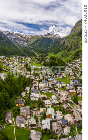 Beautiful vertical panorama of Zermatt Valley and Matterhorn Peak, Switzerland Beautiful vertical panorama of Zermatt Valley and Matterhorn Peak, Switzerland 74035010