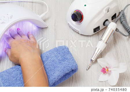 Set of cosmetic tools on a gray wooden background. Set of cosmetic tools on a gray wooden background. 74035480