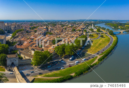 Aerial view of Avignon city on bank of Rhone river 74035493