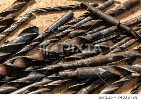 old vintage hand tools - set of drills on a wooden background old vintage hand tools - set of drills on a wooden background 74036738
