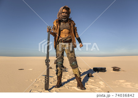 Post-apocalyptic Woman Outdoors in a Wasteland Post-apocalyptic Woman Outdoors in a Wasteland 74036842