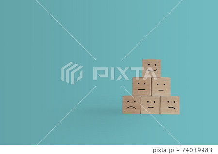Smile face and cart icon on wood cube. Optimistic person or people feeling inside and service rating when shopping, satisfaction concept. Smile face and cart icon on wood cube. Optimistic person or people feeling inside and service rating when shopping, satisfaction concept. 74039983