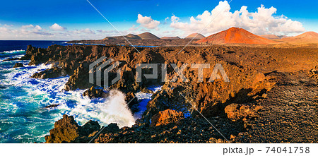 Los Hervideros lava's caves in Lanzarote island, popular touristic attraction. Canary islands Los Hervideros lava's caves in Lanzarote island, popular touristic attraction. Canary islands 74041758