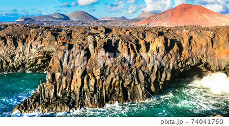 Los Hervideros lava's caves in Lanzarote island, popular touristic attraction. Canary islands Los Hervideros lava's caves in Lanzarote island, popular touristic attraction. Canary islands 74041760