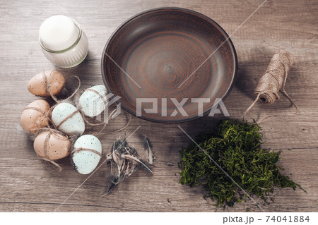 Spring decor ideas Diy. How to make Easter floral arrangement with decorative eggs, candle and moss. Spring decor ideas Diy. How to make Easter floral arrangement with decorative eggs, candle and moss. 74041884