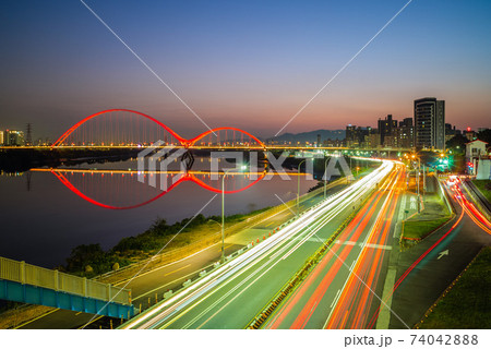 Night scene of New Taipei city by river in taiwan Night scene of New Taipei city by river in taiwan 74042888