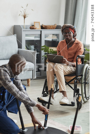 Wheelchair User Ordering Home Repair Services 74043388