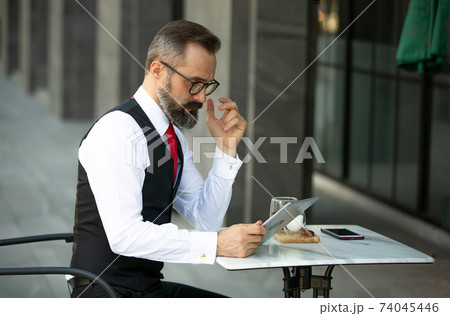 Business people talking in office using digital tablet and social media technology for communication. 74045446
