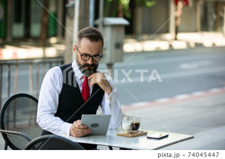 Business people talking in office using digital tablet and social media technology for communication. Business people talking in office using digital tablet and social media technology for communication. 74045447