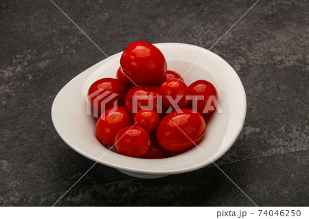 Pickled cherry tomatoes in the bowl Pickled cherry tomatoes in the bowl 74046250