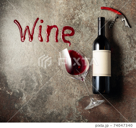 Red wine on an old rough background. Red wine on an old rough background. 74047340