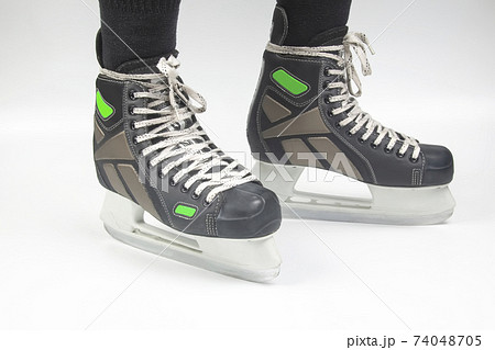 mens skates for ice skating on white background mens skates for ice skating on white background 74048705
