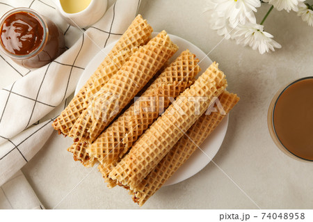 Tasty wafer rolls with condensed milk Tasty wafer rolls with condensed milk 74048958