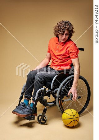 man on wheelchair in a lonely atmosphere isolated man on wheelchair in a lonely atmosphere isolated 74049213