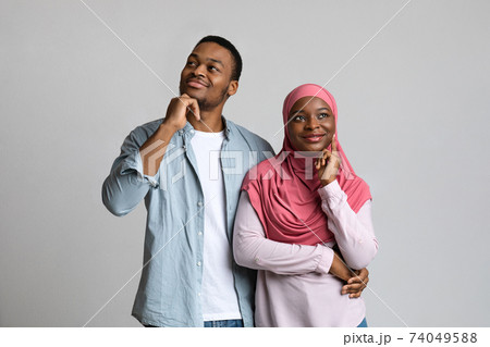 African american lovers dreaming about something on grey African american lovers dreaming about something on grey 74049588