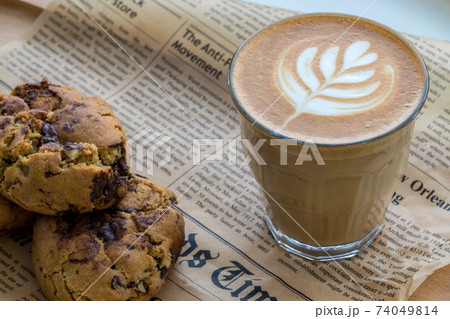 Coffee Latte Art. The coffee arts. Hot coffee in a white cup on wooden table. Coffee Latte Art. The coffee arts. Hot coffee in a white cup on wooden table. 74049814