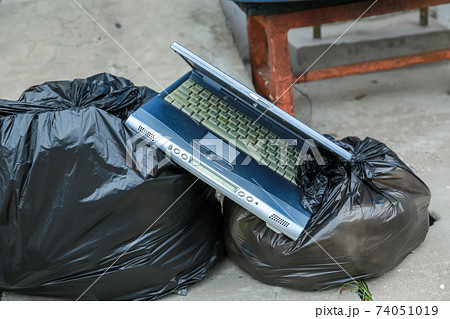 Old computer notebook put into Dustbin 74051019