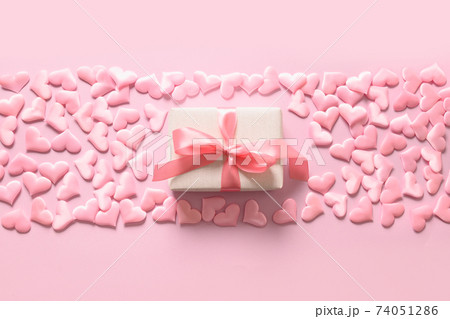 Empty blank for Valentine card with gift and pink romantic hearts on pink. Greeting card with copy space. 74051286