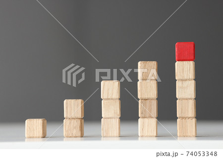 Wooden toy blocks stacked in shape of graphic Wooden toy blocks stacked in shape of graphic 74053348