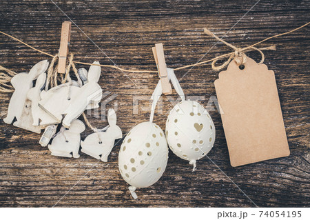 hanging easter eggs and rabbits hanging easter eggs and rabbits 74054195