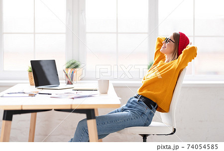 Relaxed freelancer resting on workplace 74054585