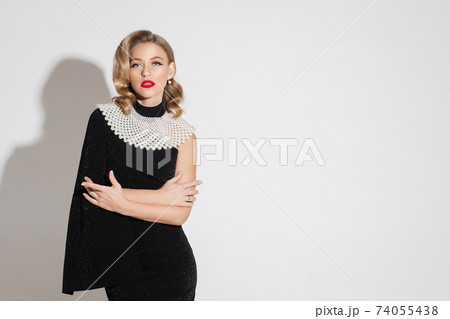 Fashionable woman with large necklace over the Fashionable woman with large necklace over the 74055438