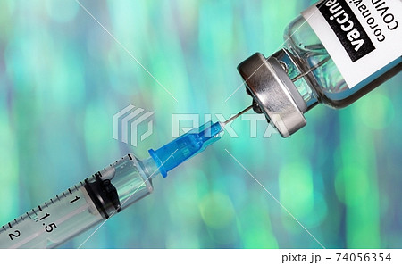 Coronavirus 2019-nCoV vaccine with syringe close up, medical concep Coronavirus 2019-nCoV vaccine with syringe close up, medical concep 74056354