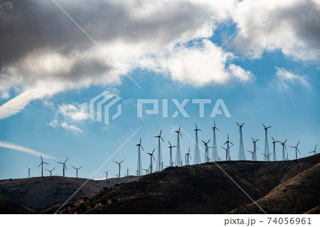 Lots of windturbines on a hill in Califronia, USA. Lots of windturbines on a hill in Califronia, USA. 74056961