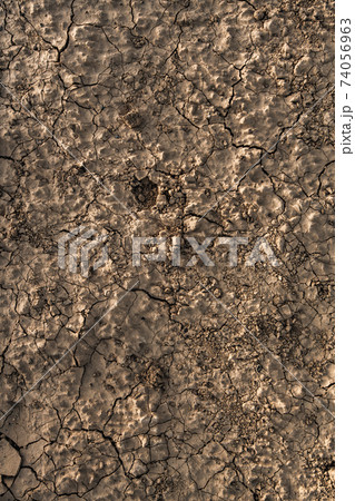 Close up of cracked dry clay. Sands of Death Valley National Park, California, USA. Close up of cracked dry clay. Sands of Death Valley National Park, California, USA. 74056963