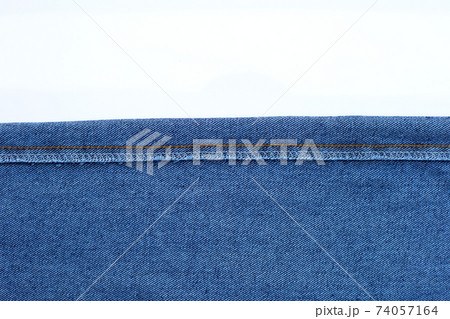 Texture of blue jeans on white Texture of blue jeans on white 74057164