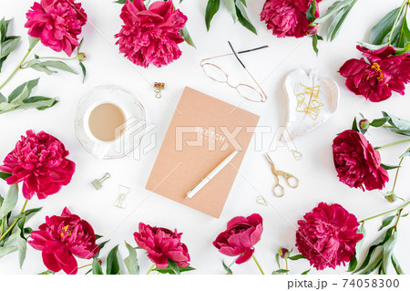 Workspace with diary, notebook, accessories, peony flowers on white background. Home office desk. Top view feminine background. Flat lay, top view Workspace with diary, notebook, accessories, peony flowers on white background. Home office desk. Top view feminine background. Flat lay, top view 74058300