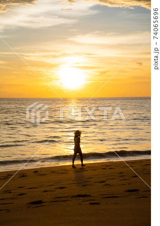 beautiful sunset at the beach in Thailand 74065696